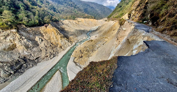A path of devastation along the Teesta River. The flood undercut the slopes in many places. A path of devastation along the Teesta River. The flood undercut the slopes in many places, triggering landslides.