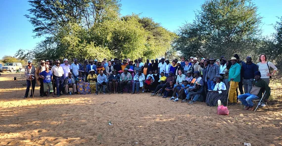 about 80 people posing for a group picture