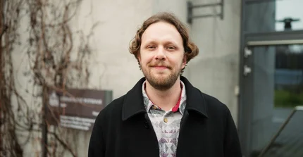 Raphael Börger lächelt in die Kamera.